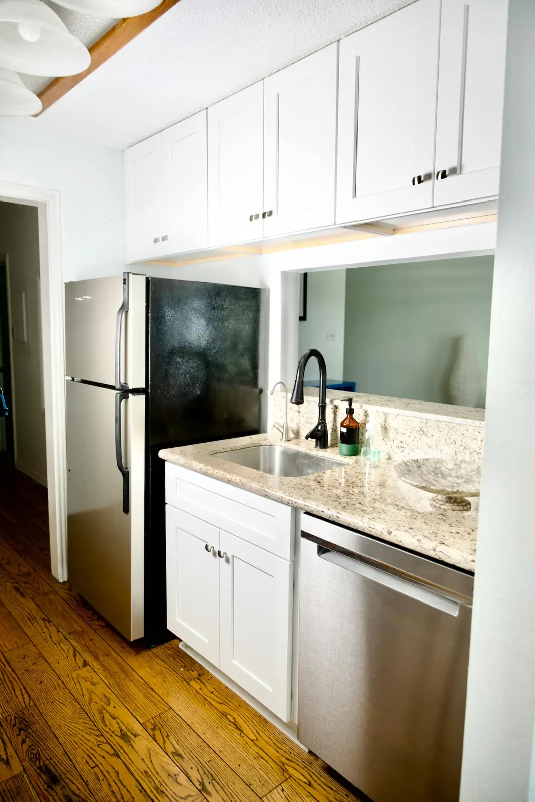 Galley kitchen with stainless appliances